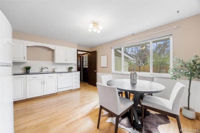 1185 Yank St, Golden, CO 80401 - dining area with light wood-style floors and bar with sink