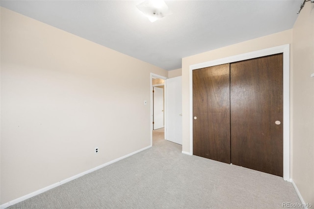 1185 Yank St, Golden, CO 80401 - unfurnished bedroom with carpet floors, baseboards, and a closet