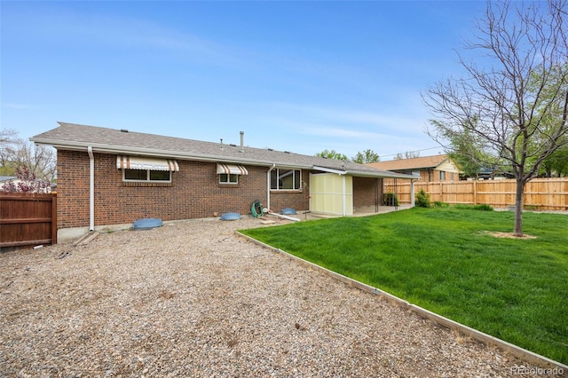 1185 Yank St, Golden, CO 80401 - rear view of property featuring brick siding and a patio