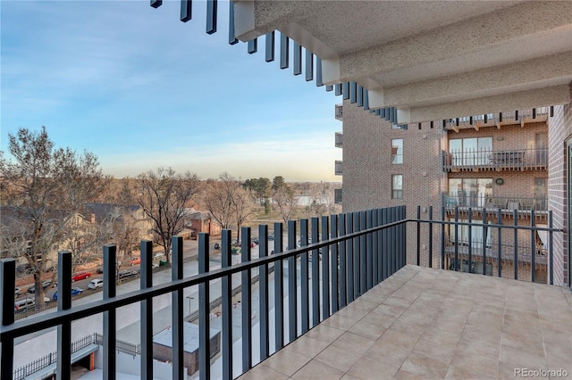 view of balcony at dusk