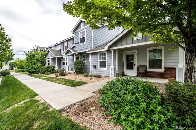 19249 E 58th Ave Unit D, Denver, CO 80249 - multi unit property featuring board and batten siding and a porch
