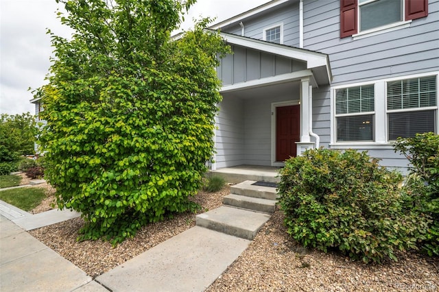 19249 E 58th Ave Unit D, Denver, CO 80249 - property entrance featuring board and batten siding