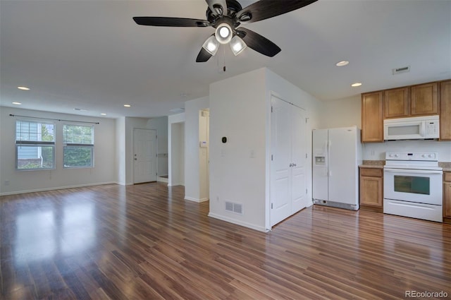 19249 E 58th Ave Unit D, Denver, CO 80249 - kitchen featuring white appliances, open floor plan, wood finished floors, and recessed lighting