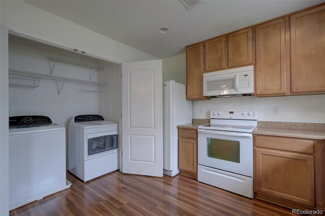 19249 E 58th Ave Unit D, Denver, CO 80249 - kitchen with white appliances, dark wood-type flooring, light countertops, separate washer and dryer, and brown cabinetry