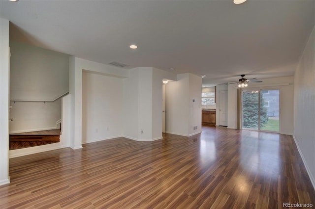 19249 E 58th Ave Unit D, Denver, CO 80249 - unfurnished living room featuring a ceiling fan, baseboards, dark wood-style flooring, and recessed lighting