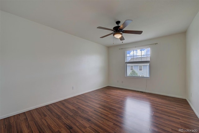 19249 E 58th Ave Unit D, Denver, CO 80249 - unfurnished room with dark wood-type flooring, a ceiling fan, and baseboards
