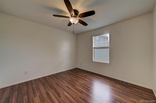 19249 E 58th Ave Unit D, Denver, CO 80249 - empty room featuring dark wood-type flooring, ceiling fan, and baseboards