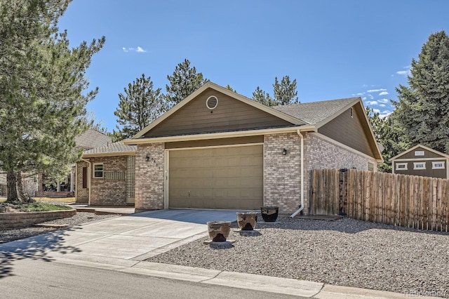 5461 S Youngfield Ct, Littleton, CO 80127 - single story home featuring a garage, brick siding, and concrete driveway