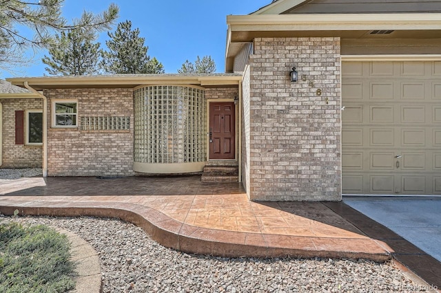 5461 S Youngfield Ct, Littleton, CO 80127 - view of exterior entry with brick siding