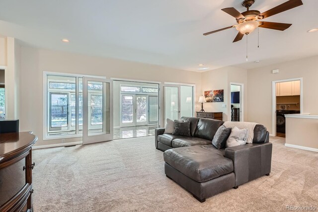 5461 S Youngfield Ct, Littleton, CO 80127 - living area featuring light carpet, recessed lighting, baseboards, and ceiling fan
