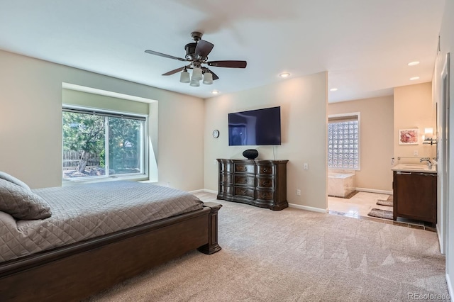 5461 S Youngfield Ct, Littleton, CO 80127 - bedroom with light colored carpet, baseboards, recessed lighting, ensuite bathroom, and a sink