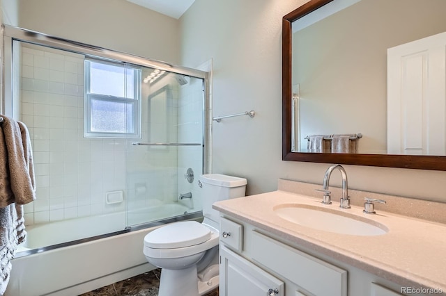 5461 S Youngfield Ct, Littleton, CO 80127 - bathroom with vanity, toilet, and combined bath / shower with glass door