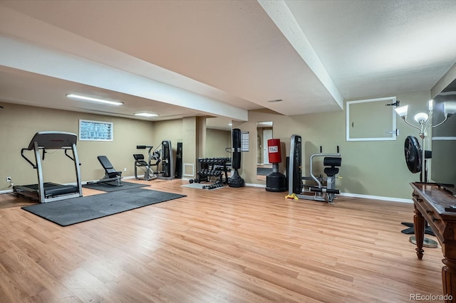 5461 S Youngfield Ct, Littleton, CO 80127 - workout room with wood finished floors and baseboards