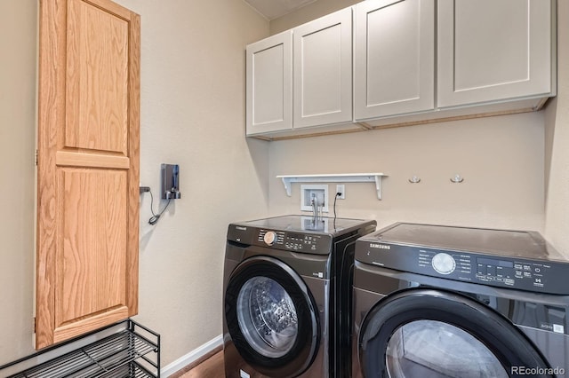 5461 S Youngfield Ct, Littleton, CO 80127 - laundry room featuring washer and dryer, cabinet space, and baseboards