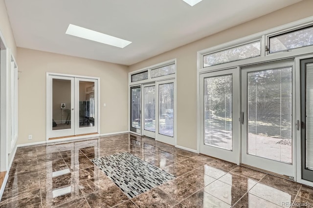 5461 S Youngfield Ct, Littleton, CO 80127 - doorway featuring french doors, a skylight, baseboards, and marble finish flooring
