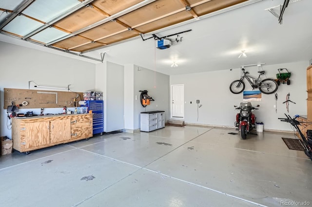 5461 S Youngfield Ct, Littleton, CO 80127 - garage with a workshop area and a garage door opener