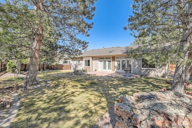 5461 S Youngfield Ct, Littleton, CO 80127 - rear view of house featuring a patio, french doors, and brick siding