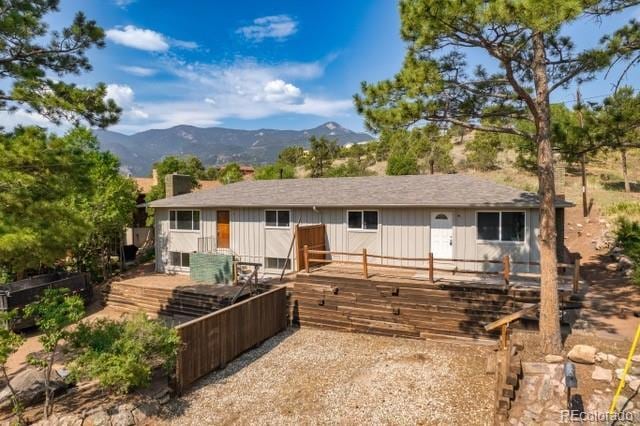 back of property with a mountain view