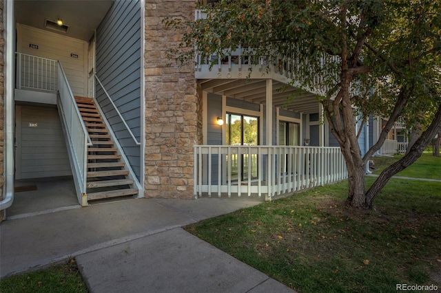 view of side of home featuring a porch