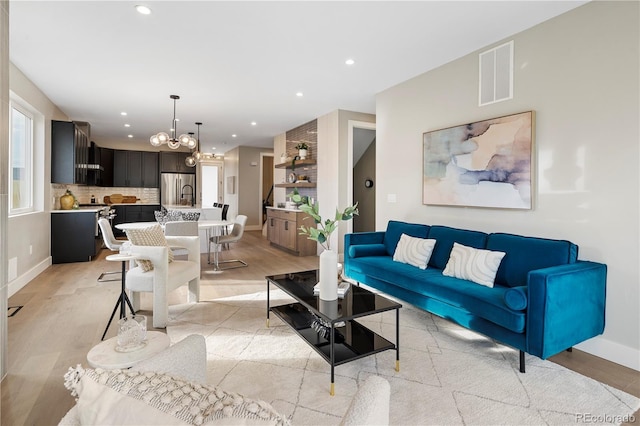 living room with a notable chandelier