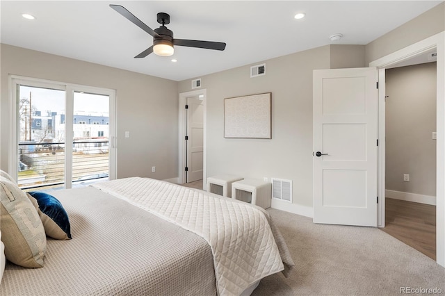 bedroom with ceiling fan and light carpet