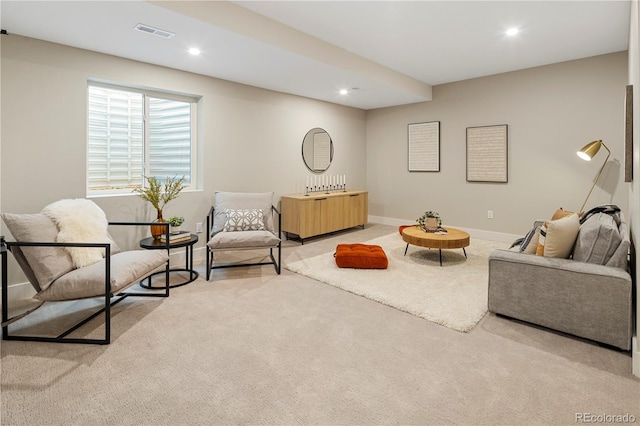 living room featuring light carpet