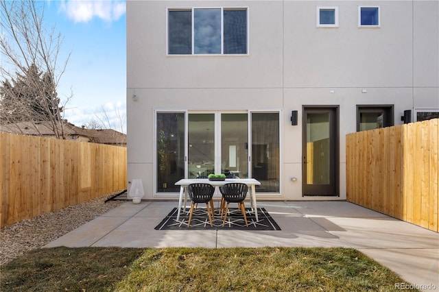 back of property featuring a patio area