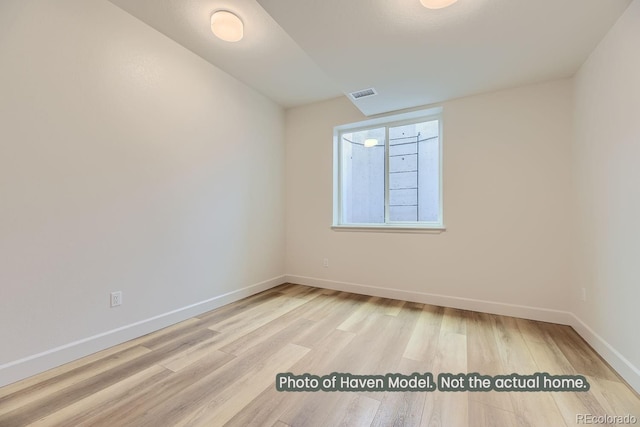 empty room with light hardwood / wood-style floors