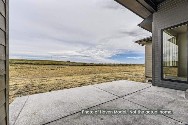 view of patio / terrace featuring a rural view