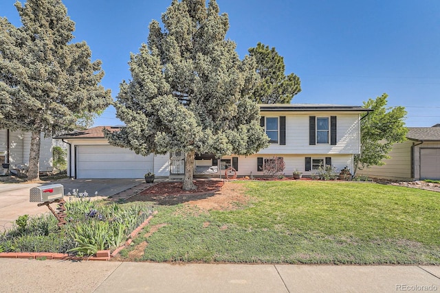 15531 E Jewell Pl, Aurora, CO 80013 - view of front facade with covered porch, concrete driveway, an attached garage, and a front yard
