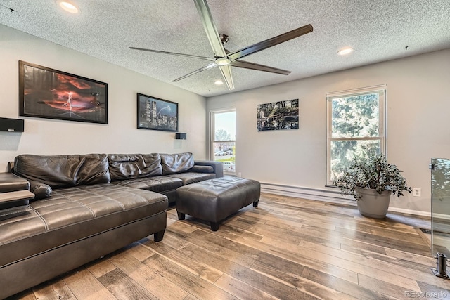 15531 E Jewell Pl, Aurora, CO 80013 - living area featuring ceiling fan, a textured ceiling, hardwood / wood-style floors, a baseboard radiator, and recessed lighting