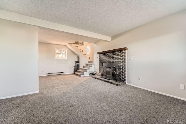 15531 E Jewell Pl, Aurora, CO 80013 - unfurnished living room featuring baseboard heating, carpet, stairs, a textured ceiling, and baseboards