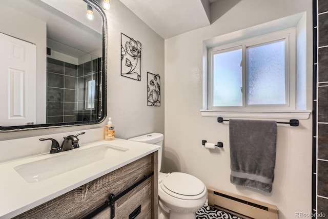 15531 E Jewell Pl, Aurora, CO 80013 - bathroom featuring a baseboard radiator, toilet, vanity, and a shower with shower door