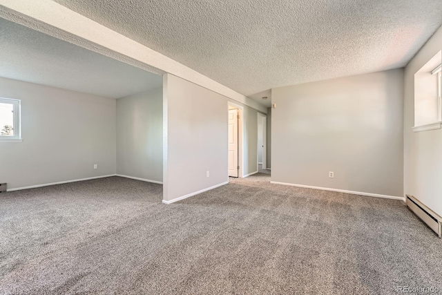15531 E Jewell Pl, Aurora, CO 80013 - carpeted empty room featuring a textured ceiling, baseboards, and baseboard heating