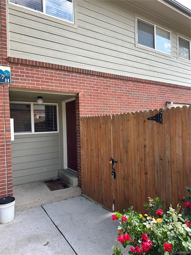 8047 Wolff St Unit H, Westminster, CO 80031 - view of exterior entry featuring brick siding