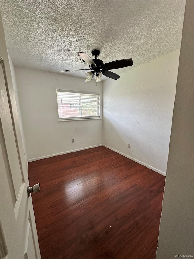 8047 Wolff St Unit H, Westminster, CO 80031 - empty room featuring wood finished floors, a textured ceiling, ceiling fan, and baseboards