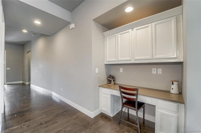 office featuring built in desk, recessed lighting, dark wood finished floors, and baseboards