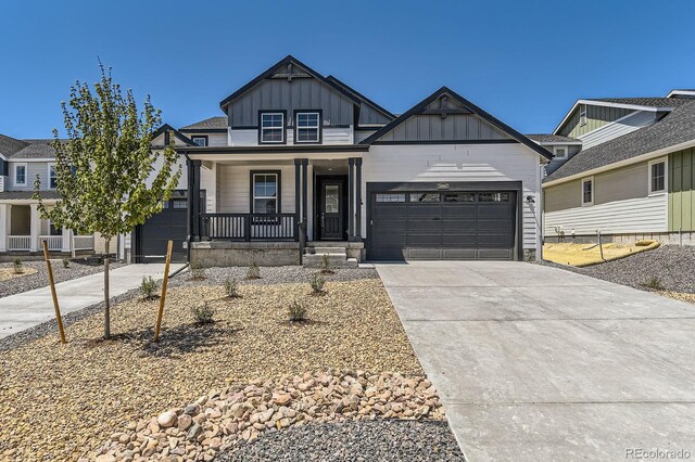39867 Floyd St, Elizabeth, CO 80107 - craftsman-style home featuring board and batten siding, covered porch, driveway, and an attached garage