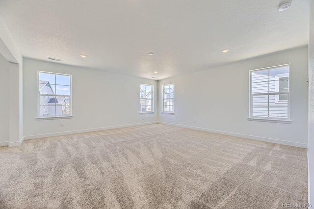 39867 Floyd St, Elizabeth, CO 80107 - empty room with a smoke detector, light carpet, baseboards, and recessed lighting
