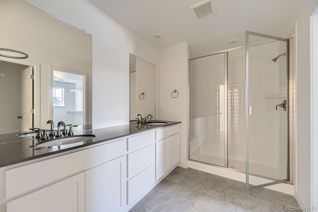 39867 Floyd St, Elizabeth, CO 80107 - bathroom featuring a shower stall and double vanity