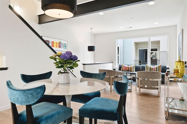 dining space featuring light wood-style floors, visible vents, and recessed lighting