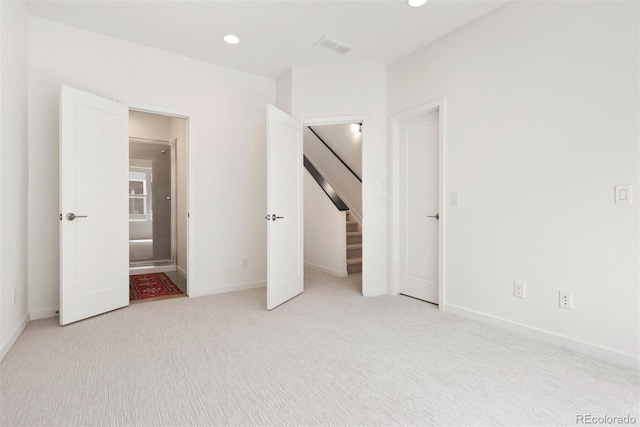 unfurnished bedroom with light carpet, baseboards, visible vents, and recessed lighting