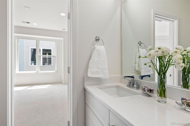 bathroom with vanity and visible vents