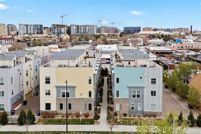 birds eye view of property with a view of city
