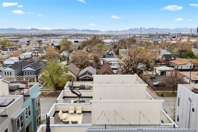 drone / aerial view featuring a residential view and a mountain view