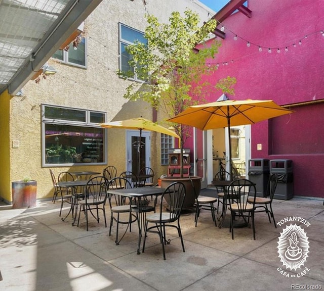 view of patio featuring outdoor dining area