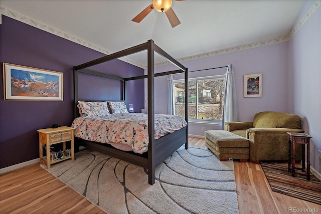 bedroom with hardwood / wood-style flooring and ceiling fan