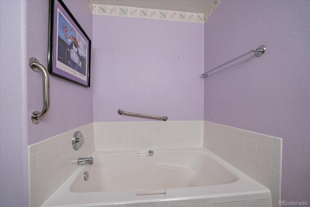 bathroom featuring tiled bath