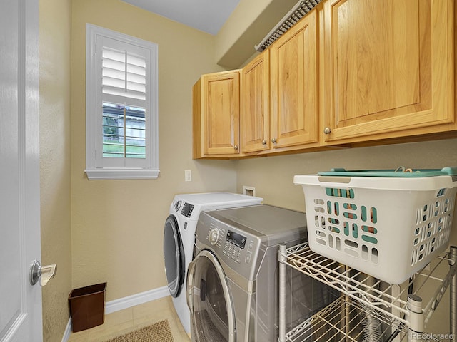 9246 Sori Ln, Highlands Ranch, CO 80126 - laundry room featuring separate washer and dryer, cabinet space, baseboards, and light tile patterned flooring