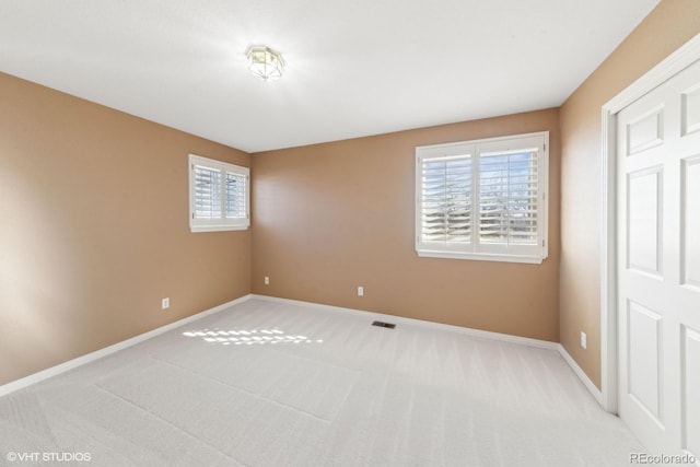 unfurnished bedroom featuring light colored carpet